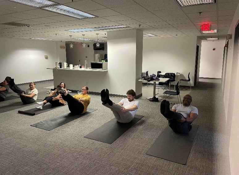 Pilates Class. In addition to the on-site gym, AAAE provides periodic classes for staff to encourage health & wellness.