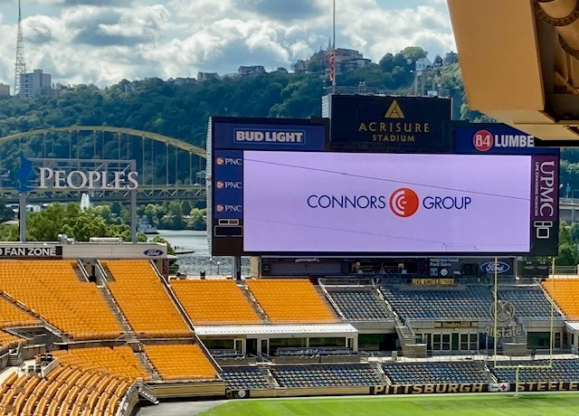  The Connors Group logo lights up Acrisure Stadium for our annual staff session. A venue selected to spark creativity.