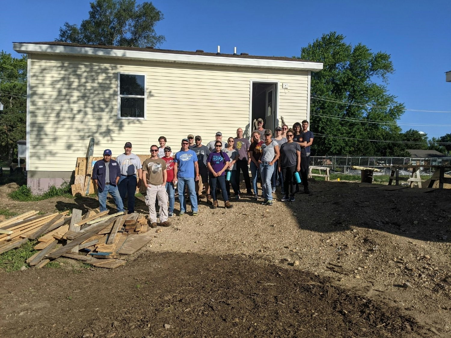 Members of our Community Action Team participating on a local home site build. 