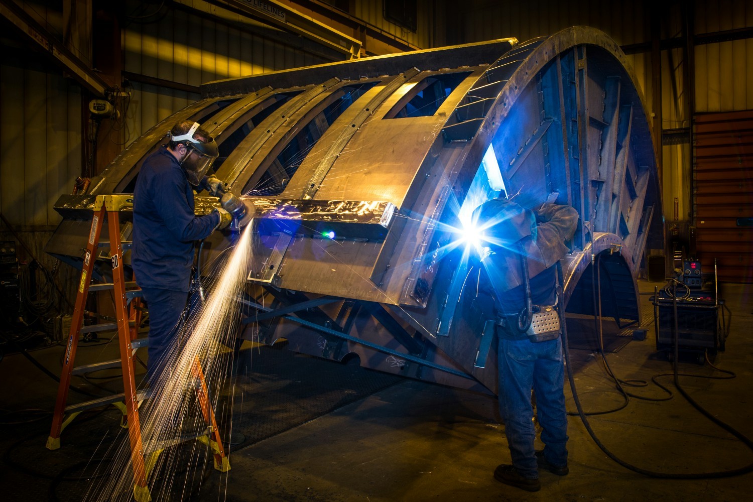 GK manufacturing employees are hard at work on our custom manufacturing equipment.