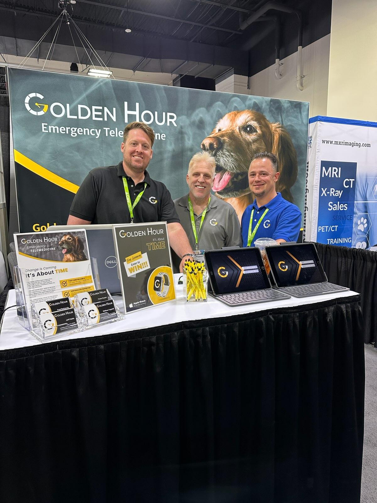 Team members in Denver at a conference meeting customers. 