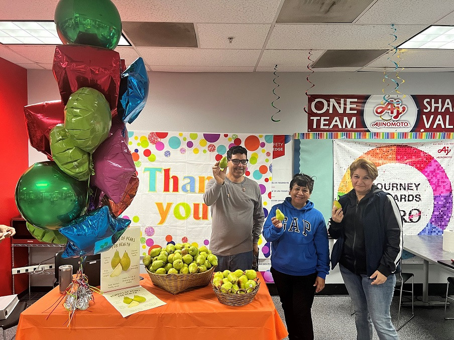 Employees enjoy pears as part of our wellness program supporting holistic health and nutrition for all team members.