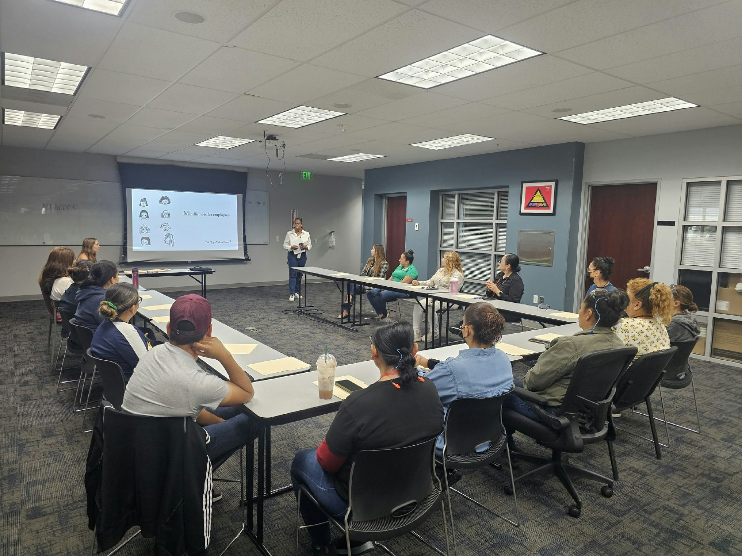 Employees attend a mental health event on mindfulness, supporting our holistic wellness strategy.