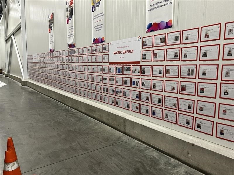 A wall display of employee safety pledges, sharing personal reasons and commitments to working safely every day.
