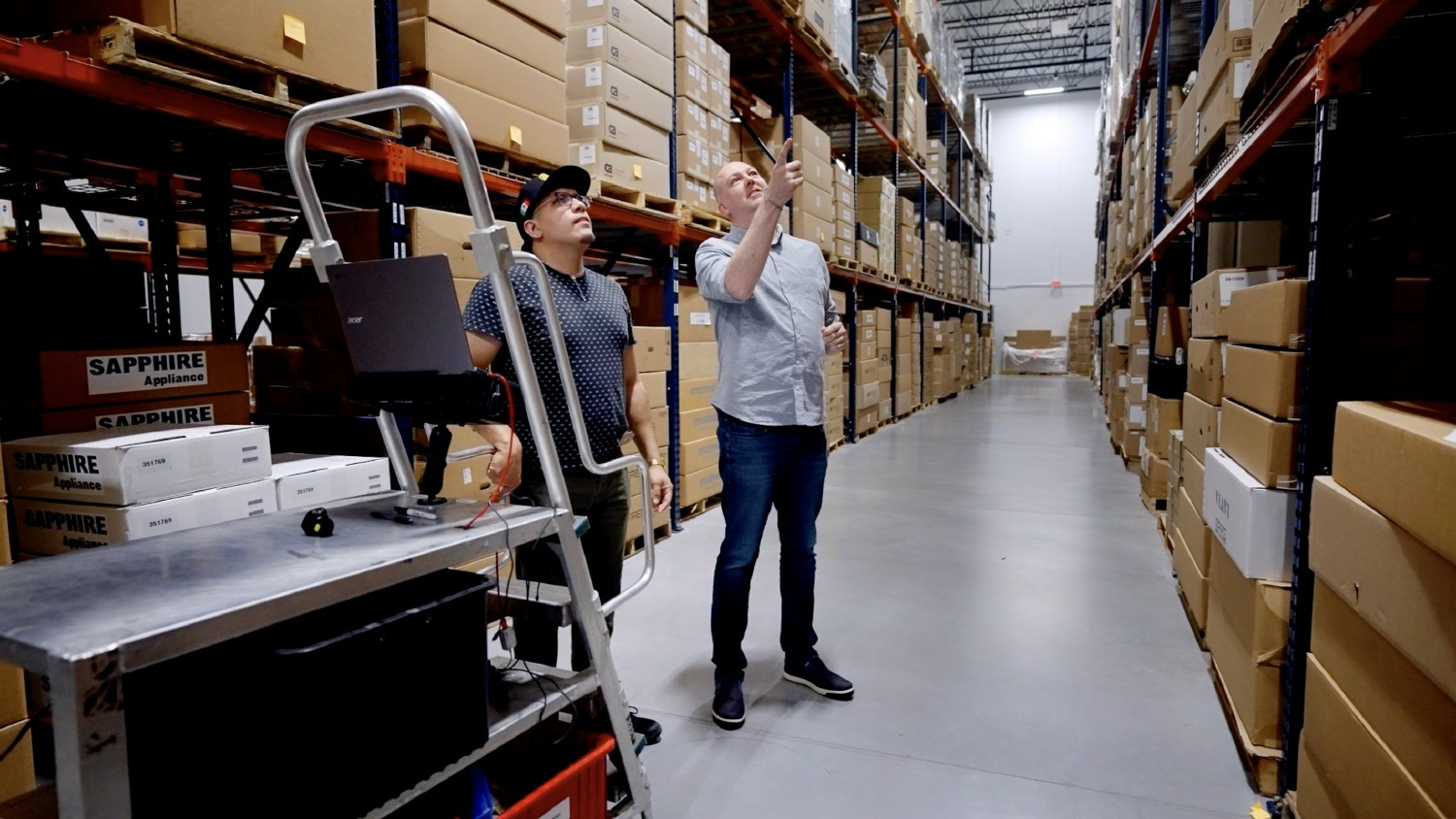 Our team members checking inventory in our warehouse. 