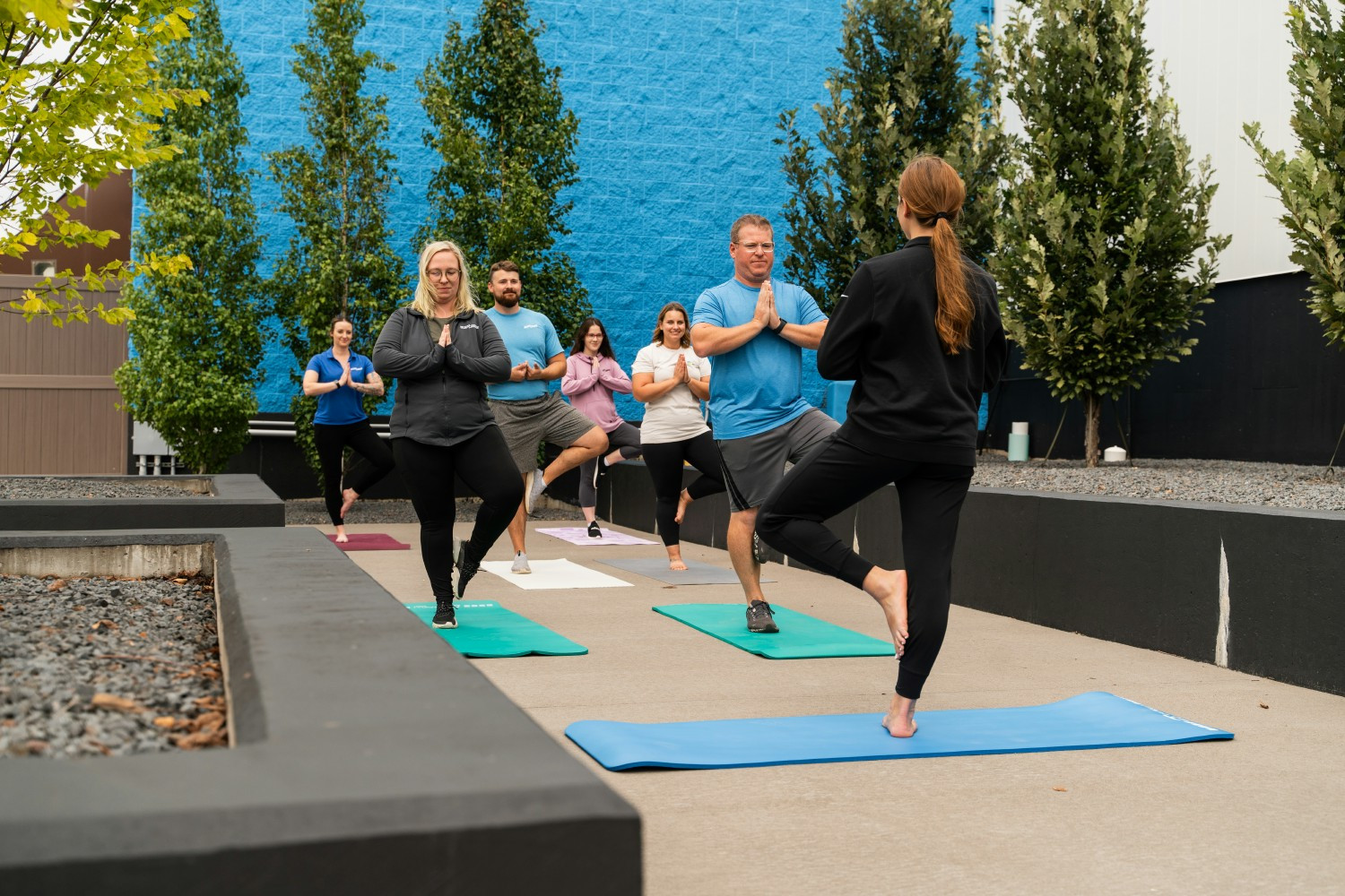 Patio Yoga with our dedicated Health & Wellness Coordinator 