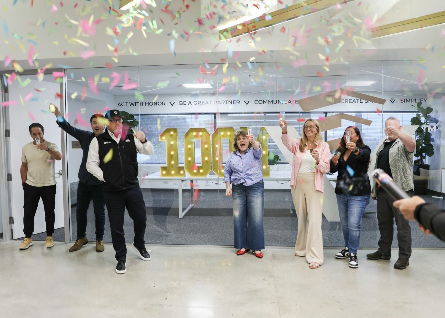 Celebrating a major milestone, our leadership team popped the confetti when we hit $100 Million in loans funded.