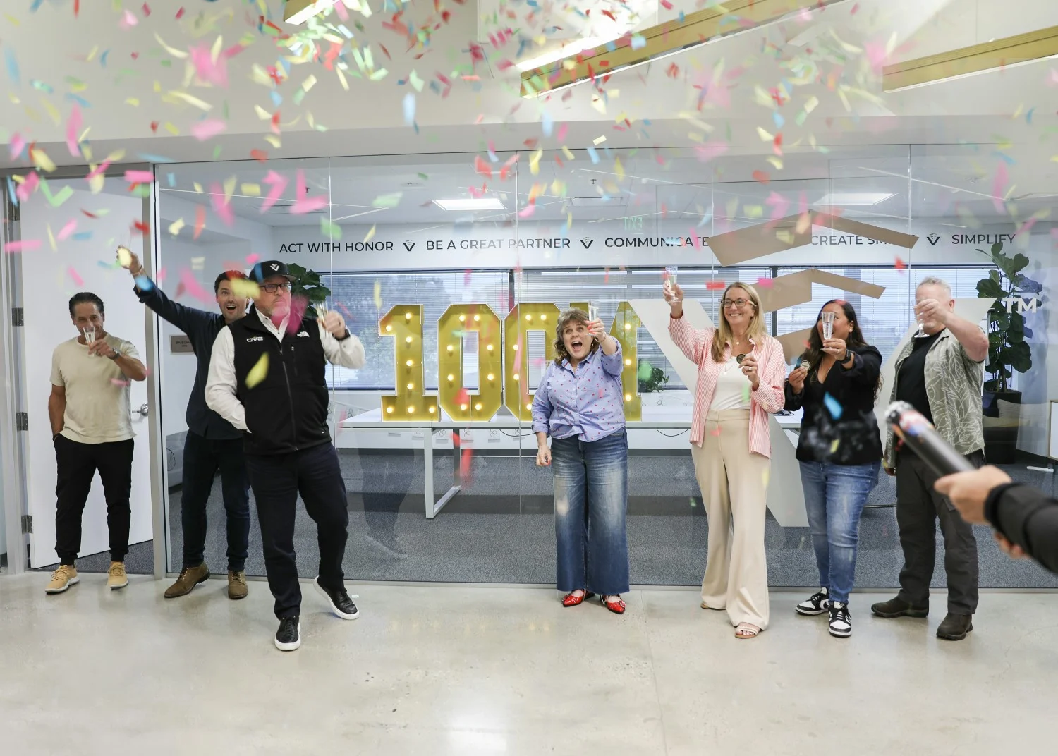 Celebrating a major milestone, our leadership team popped the confetti when we hit $100 Million in loans funded.