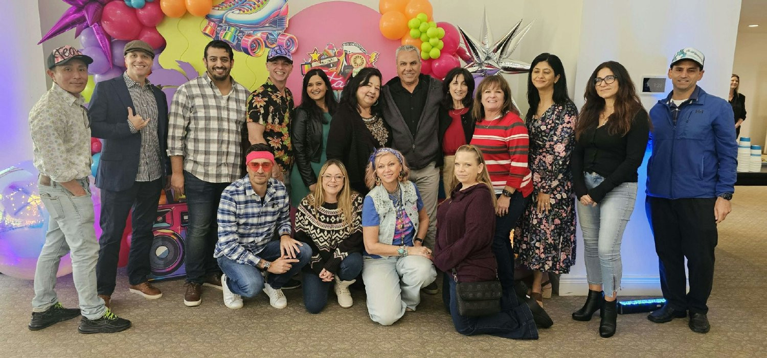 Employees getting in the 80's spirit with a holiday celebration (company was founded in 1980). 