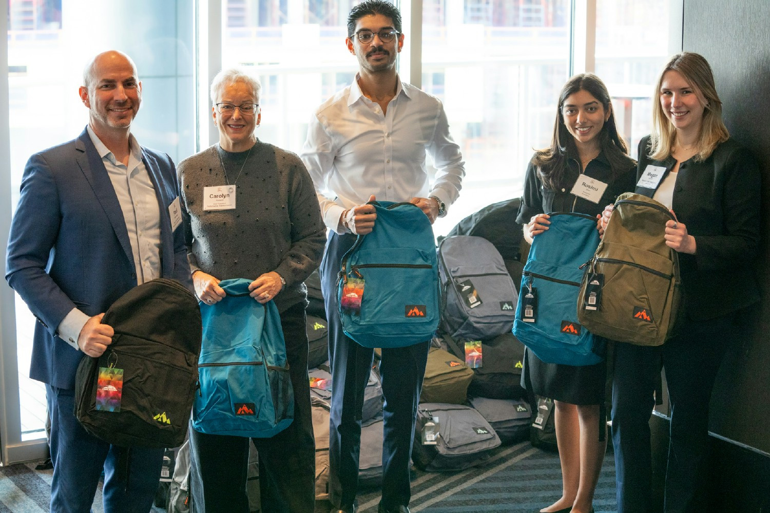 Acuvance team members participating in The Backpack Project during our Annual Company Meeting.