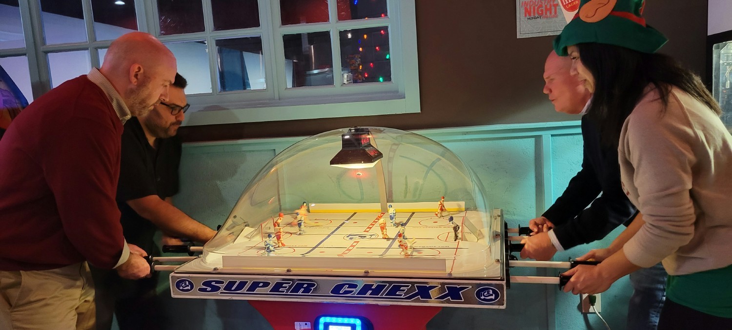 A heated game of bubble hockey between our executives and staff.