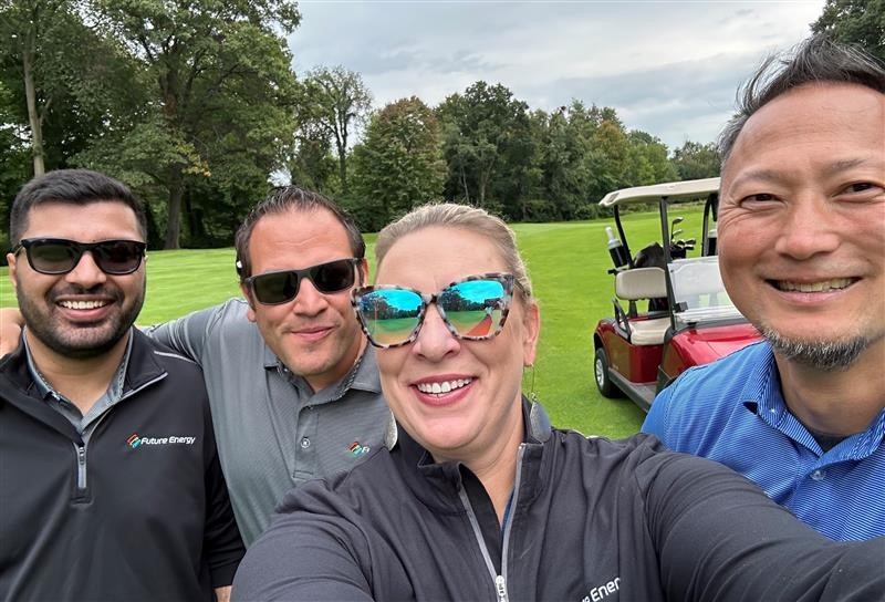 Team members take a selfie at our annual company golf outing.