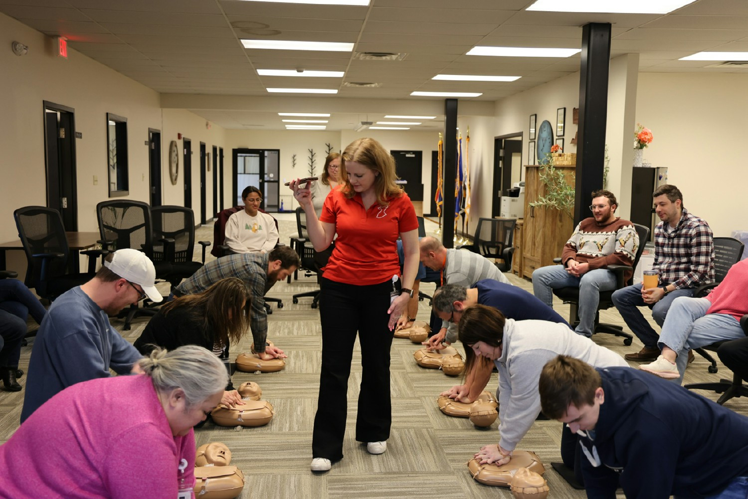 Employees participating in Hands-Only CPR training to build confidence and emergency response skills.