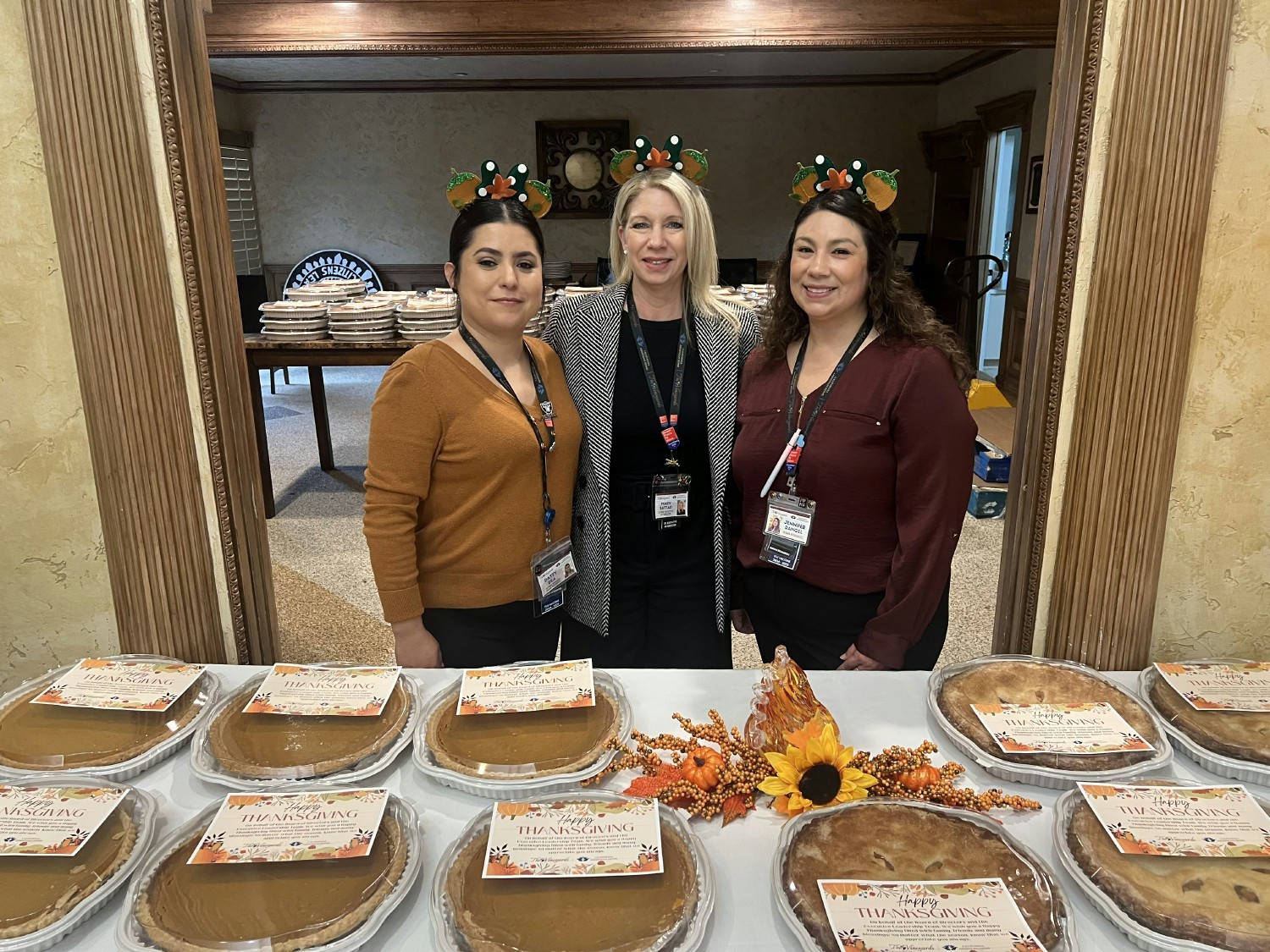 HR team serving up pies to employees for Thanksgiving!