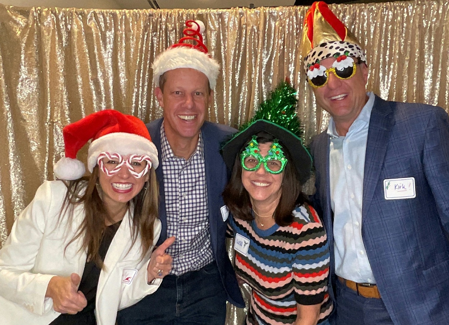 Senior leaders demonstrated our value of enjoyment in the photo booth at our 2023 holiday party.