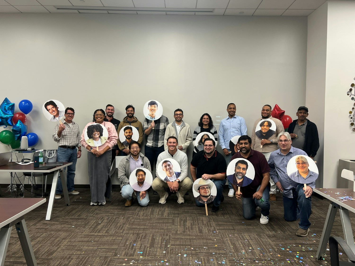 Honoring our product launch all-stars! A sports-themed town hall celebrated the team with poster-sized photos and fun!