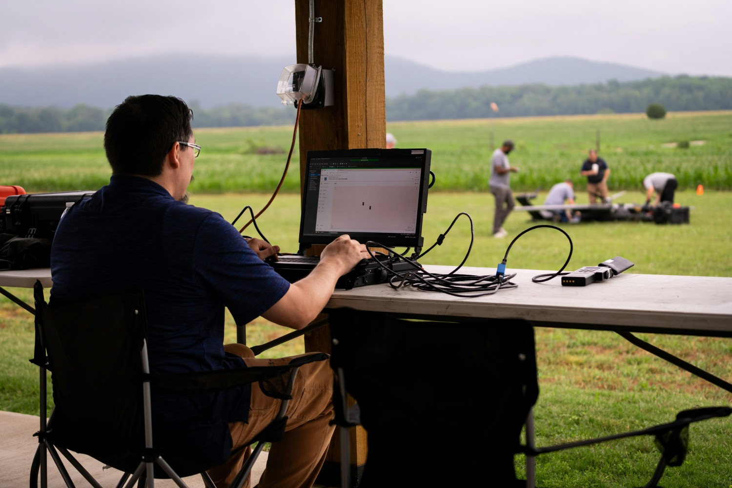 Our engineers working together in the field during a successful test of the mission systems they built.