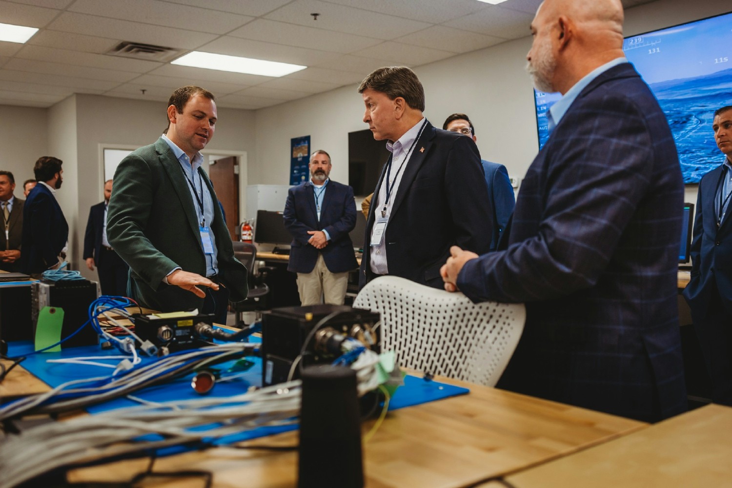 JD Parkes, CEO, walking Congressman Mike Rogers of Alabama through our in-house lab at our Huntsville office. 
