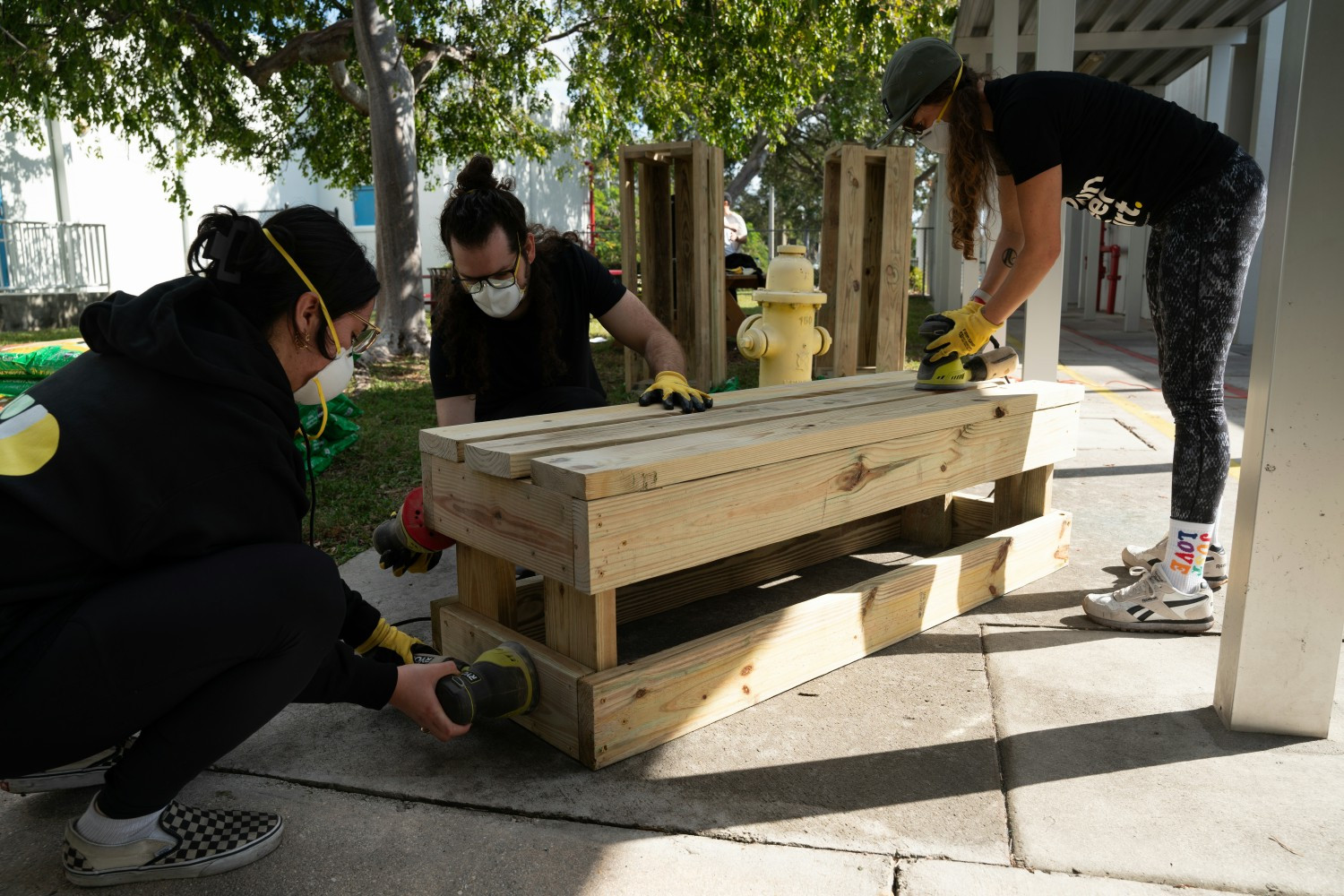 AG team building benches during campus beautification project at MLK Montessori Elementary School, Ft. Lauderdale, FL. 