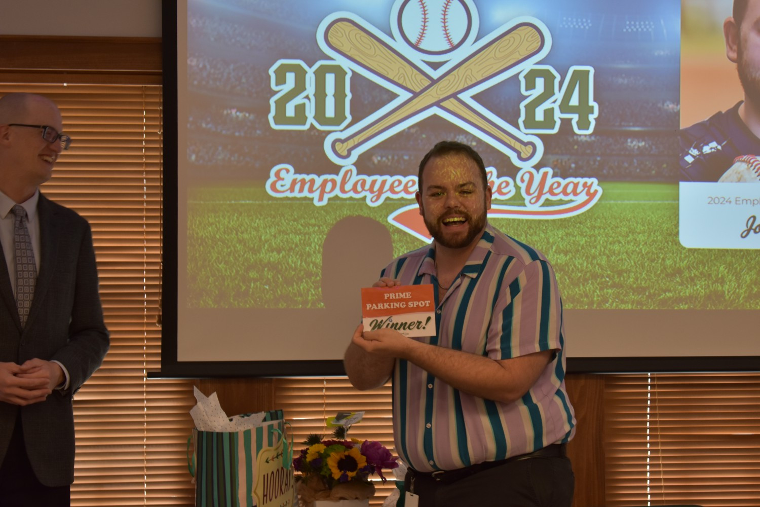 2024 Employee of the Year winner, showing off his premium parking spot card! 