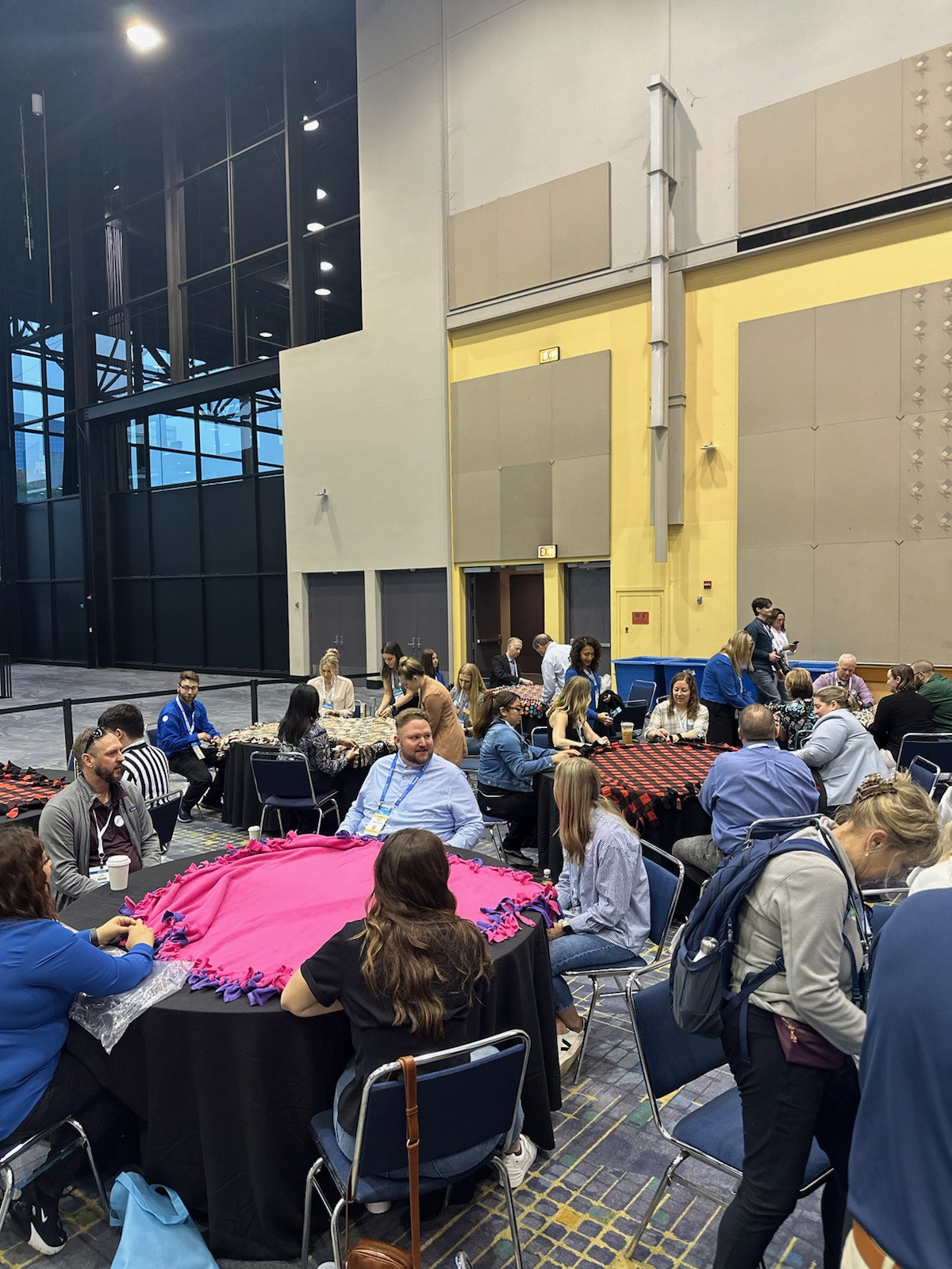 Charity event making blankets for homeless shelter.