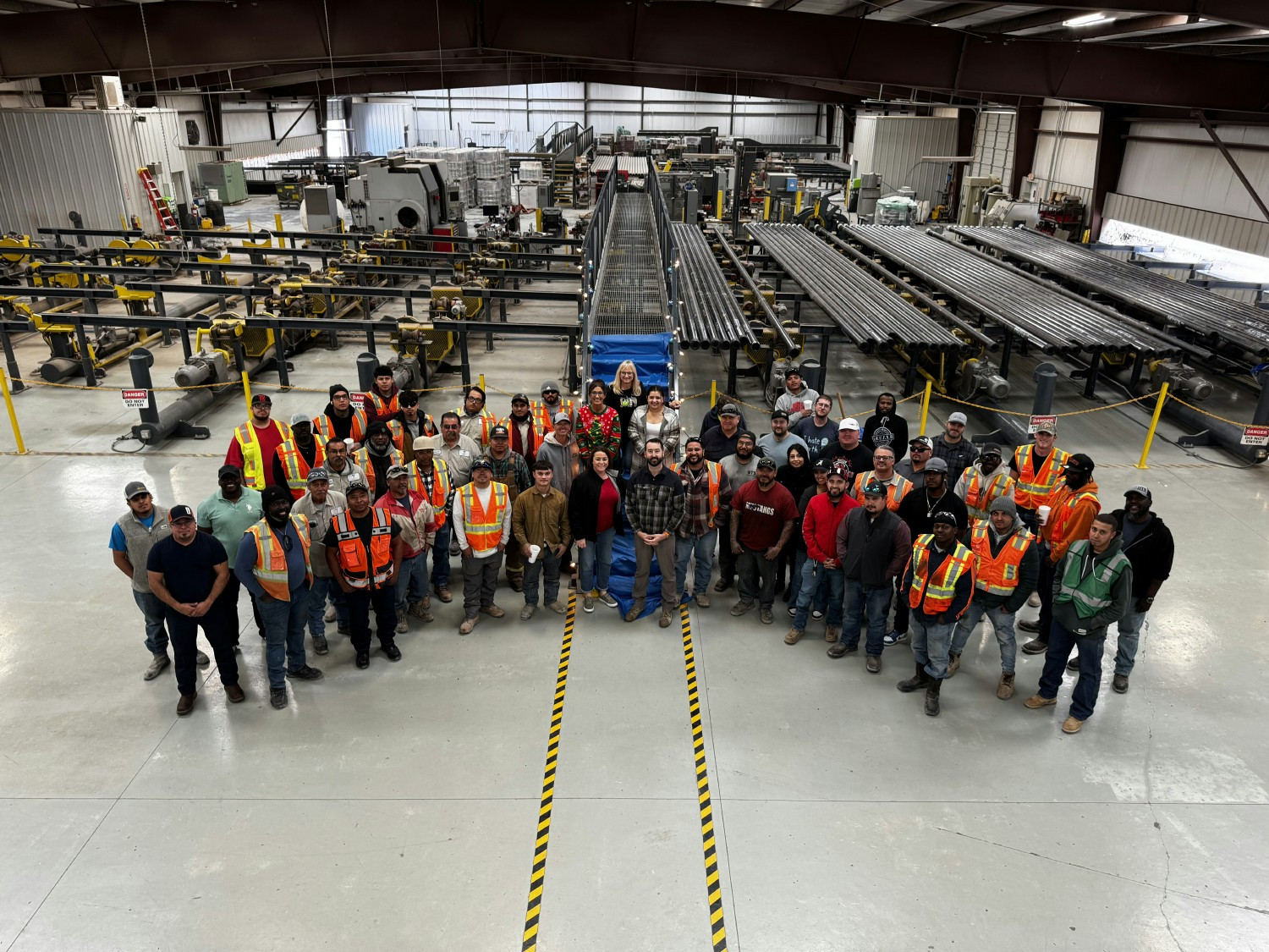 The team in Midland gathers for a holiday photo, celebrating the season and a year of hard work.