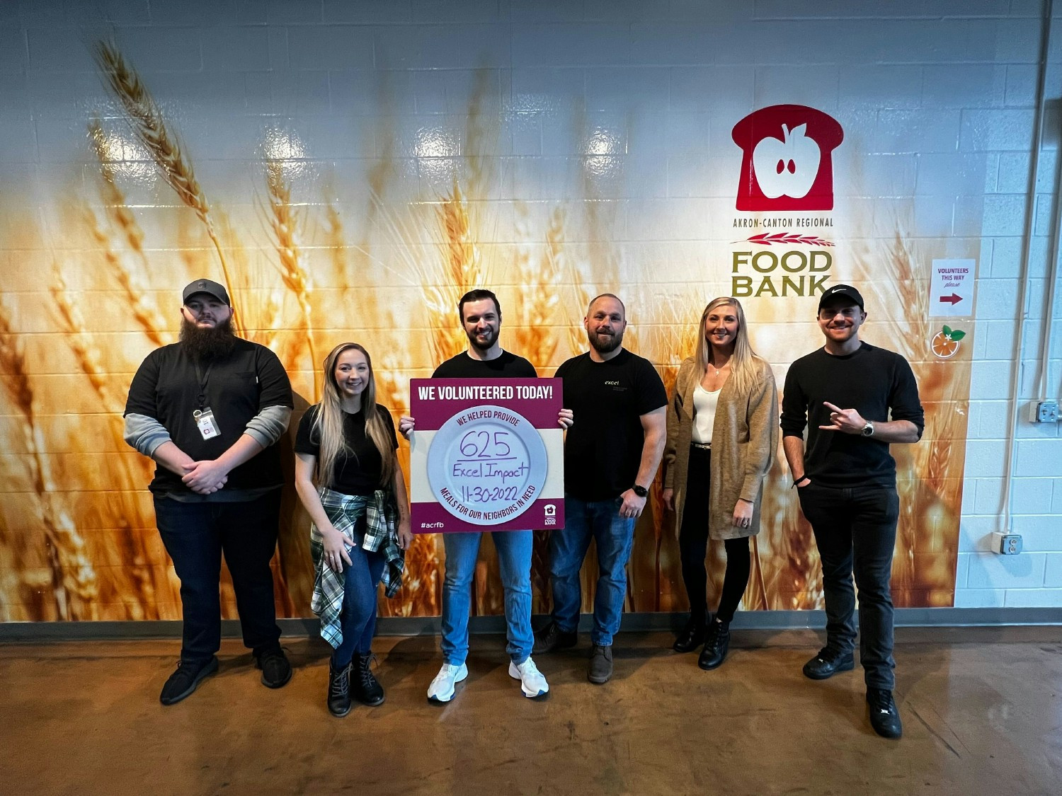 Volunteering at a local food bank where we helped provide 625 meals to our neighbors in need.