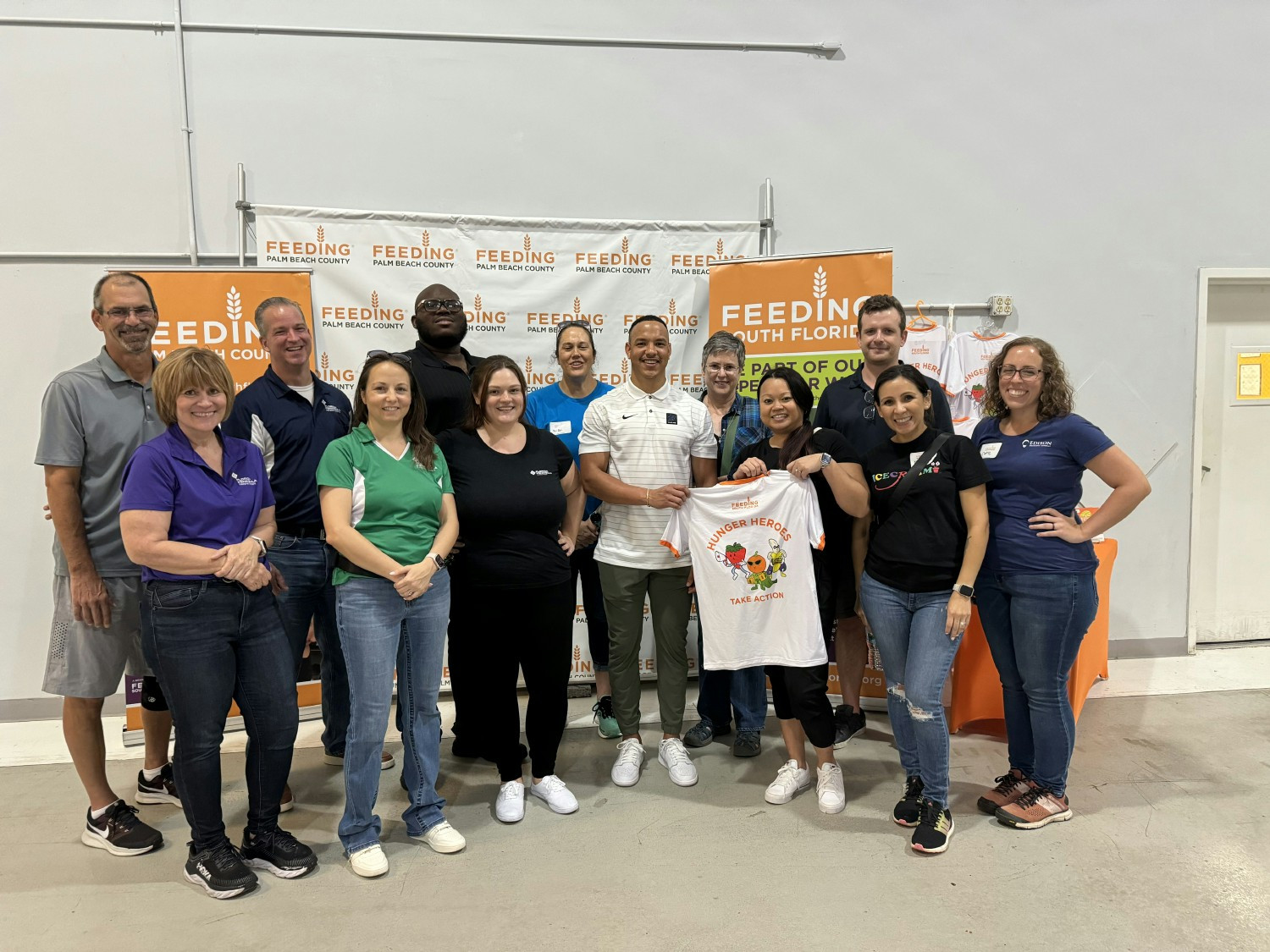 Operations Team Members creating care packages for Feeding South Florida as a teambuilding activity.