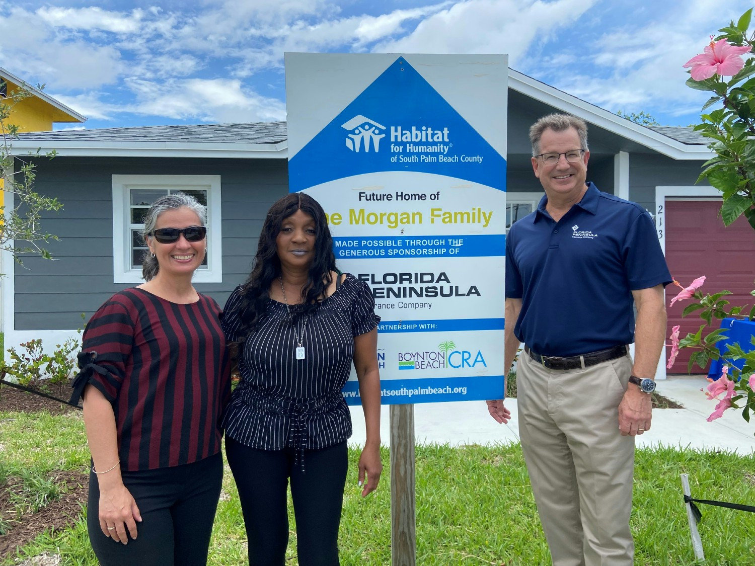 Our CEO, Paul Adkins, giving the keys to a new owner of a Habitat for Humanity home we sponsored in Palm Beach county. 