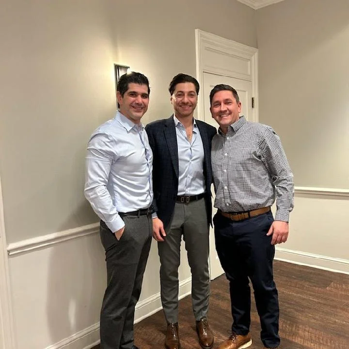 Dr. Sabbagh, Dr. Ghanem and Dr. Yarbrough enjoy a holiday dinner celebration with the AMSPC team. 