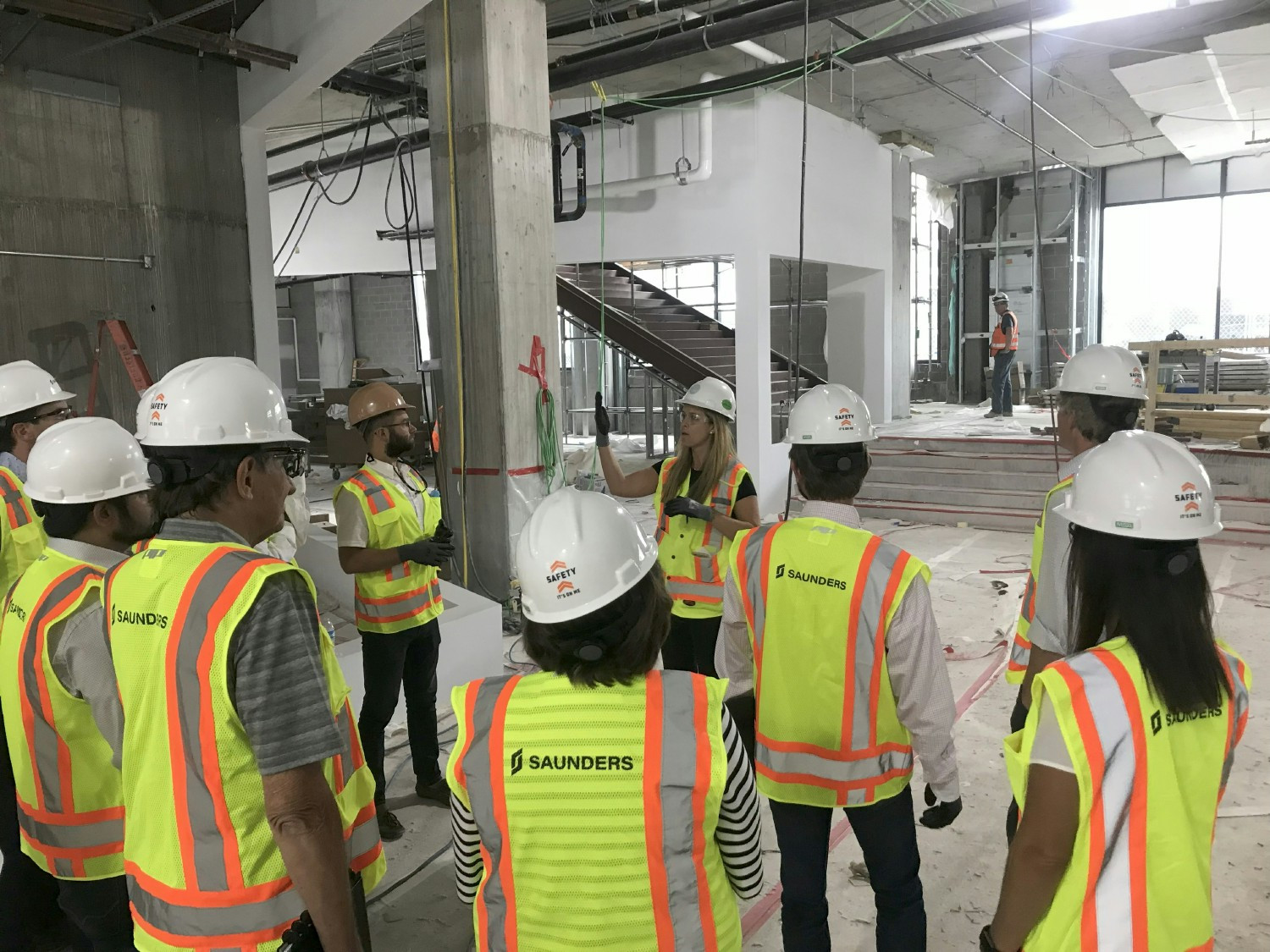 Team gathers for project updates on site in Charleston—collaboration in action.