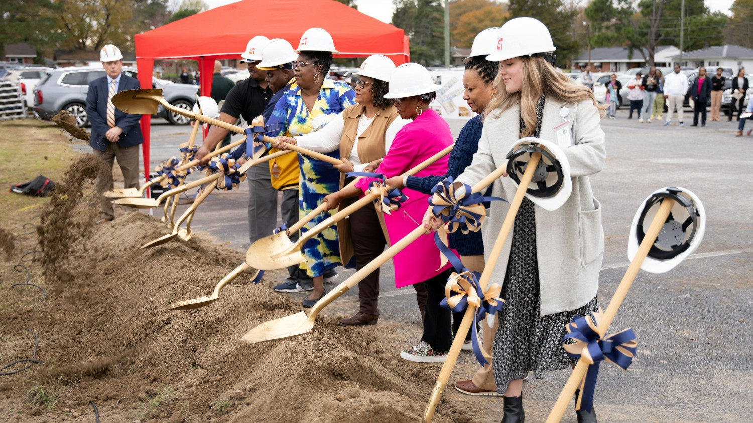 Employees helped break ground on new school in Halifax County funded with more than $50 million raised by the lottery.