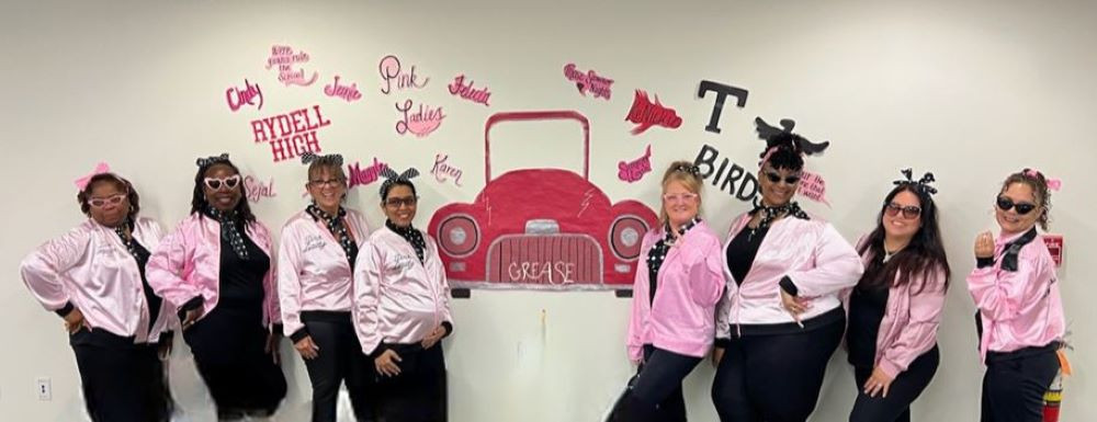 Our Payment Solutions team channels the Pink Ladies to victory in our annual Halloween costume contest!