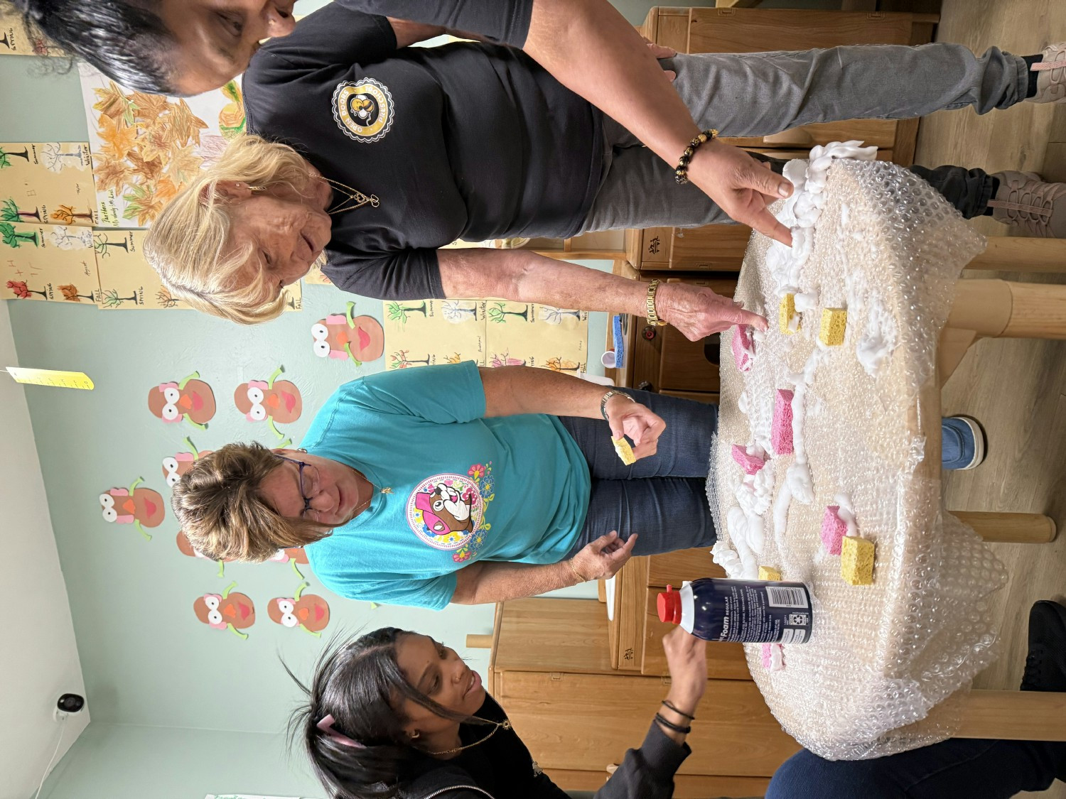  Hands-on learning for teachers, too! Creativity and teamwork in action at Open Doors Preschool.