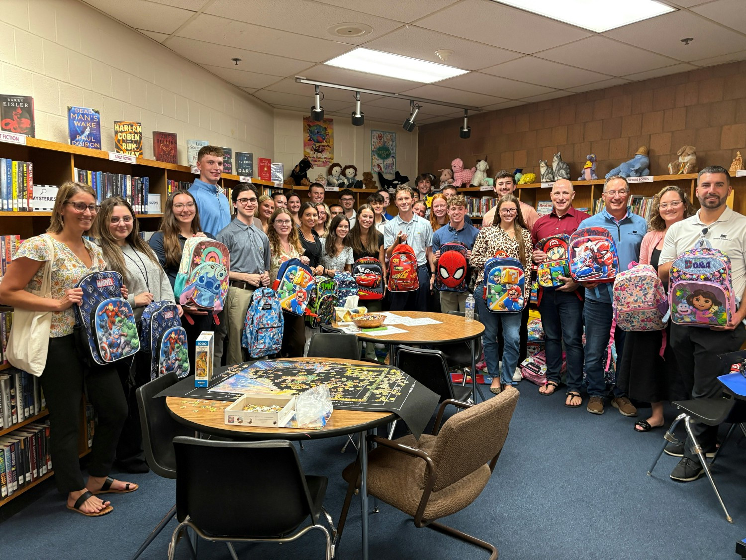As one of their service projects, interns assembled and delivered backpacks to a local community school.