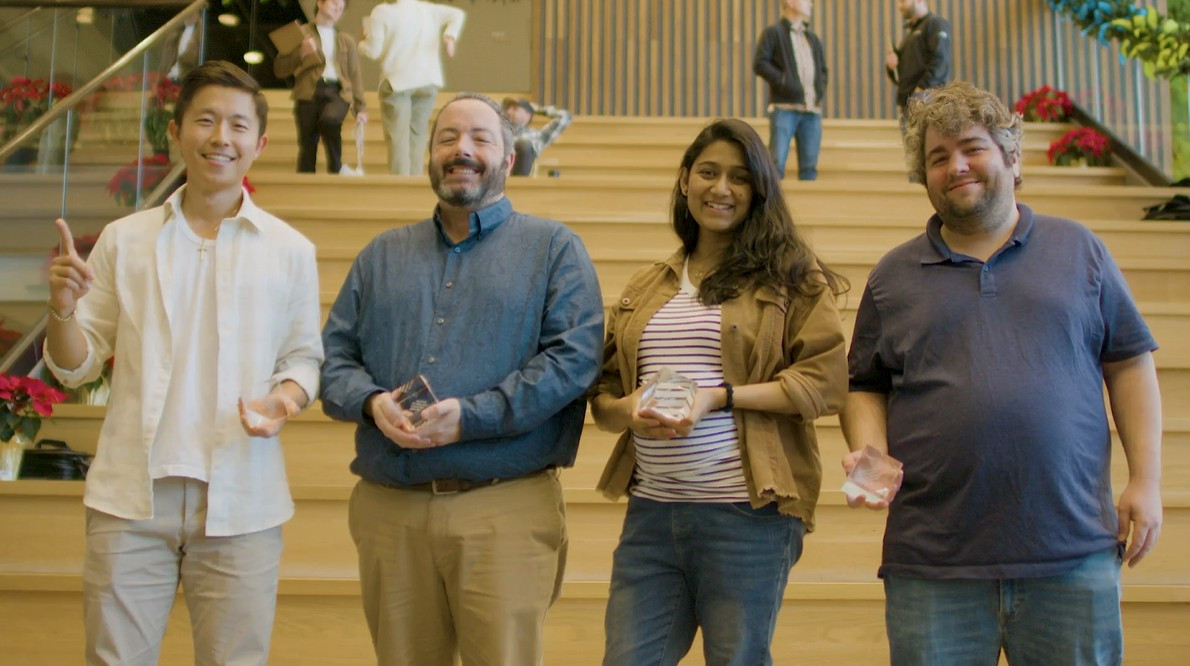 A winning team celebrates their $10,000 victory at nCino’s annual Hackathon awards ceremony.