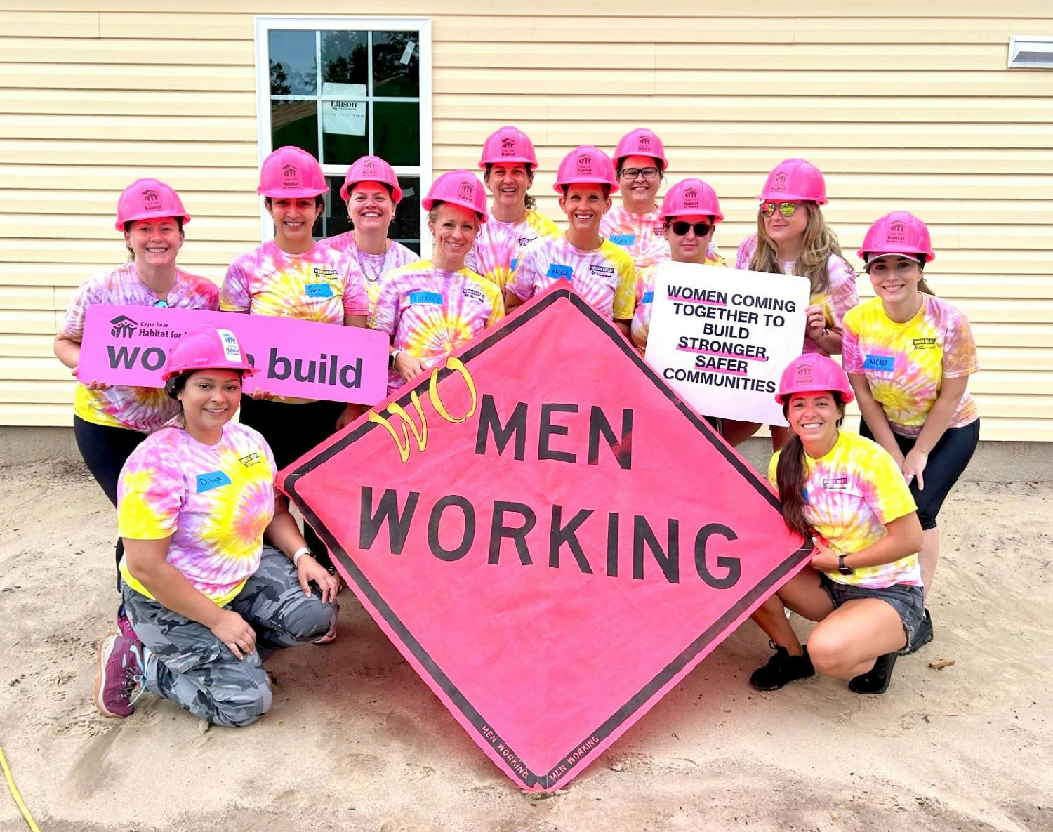 Members of nCino's Women in Tech employee resource group work side-by-side at a Habitat for Humanity build.