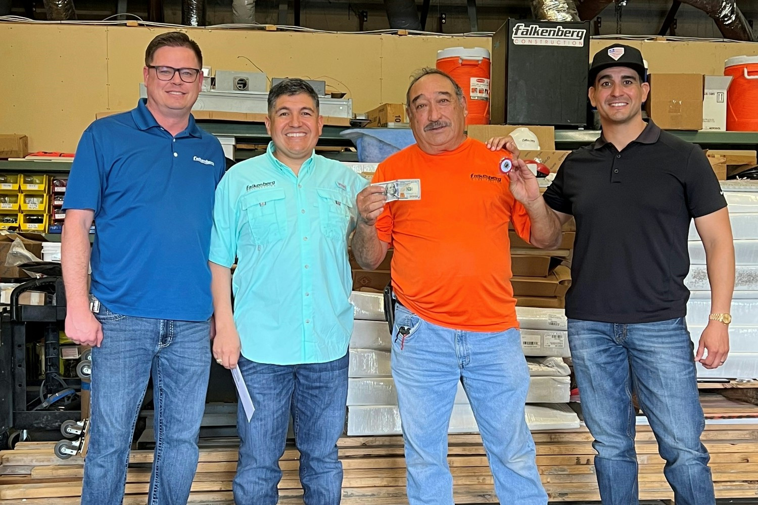 Arturo Sr. proudly receives his Core Value Coin, voted on by peers for Acting with Integrity.