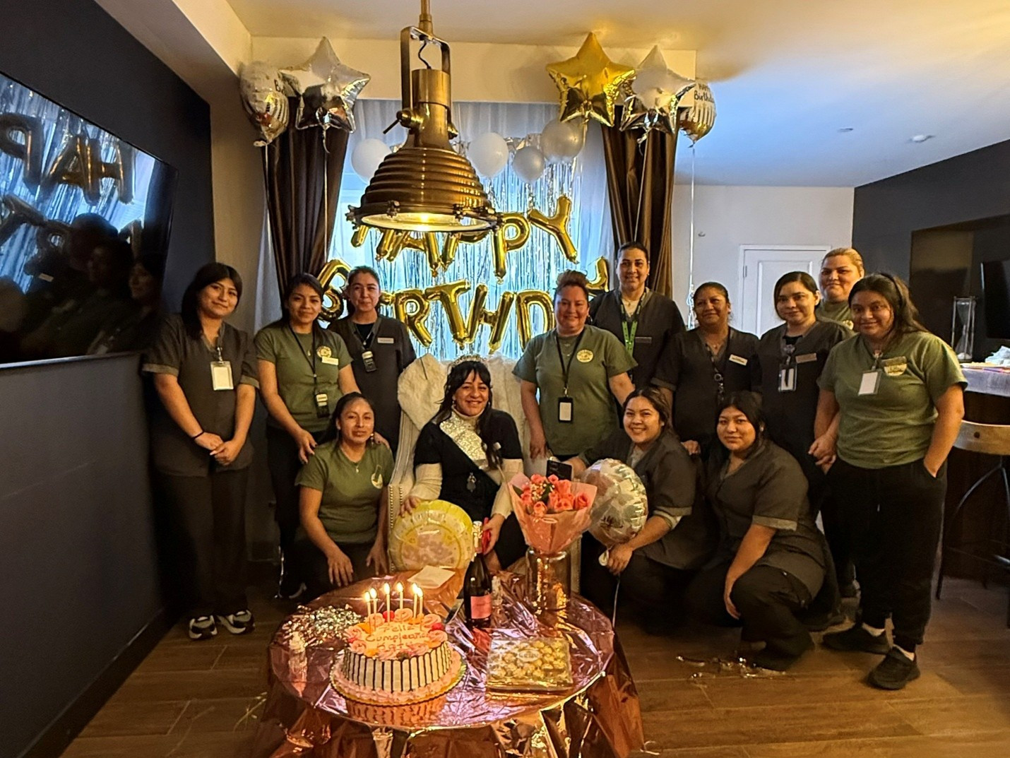 Team members coming together to celebrate a special moment. 