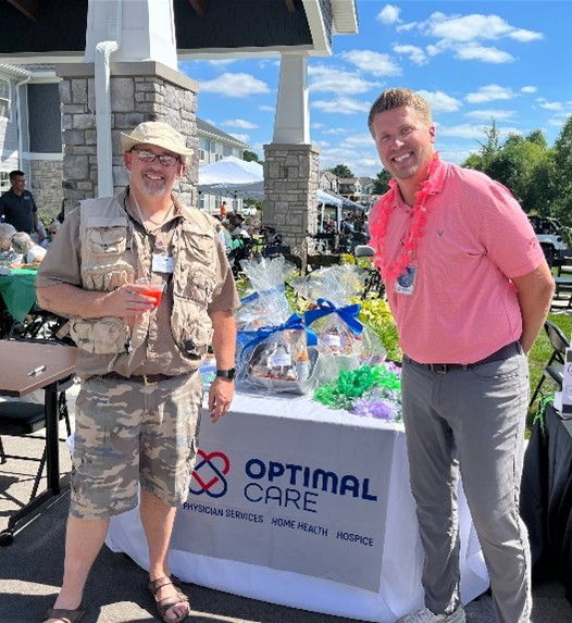Optimal Care Employees (Resource Coordinator Cory Baar and Nurse Practitioner Eric Strother) at a local community event.