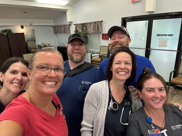 Optimal Care Employees showing off their new Optimal Care clothing.