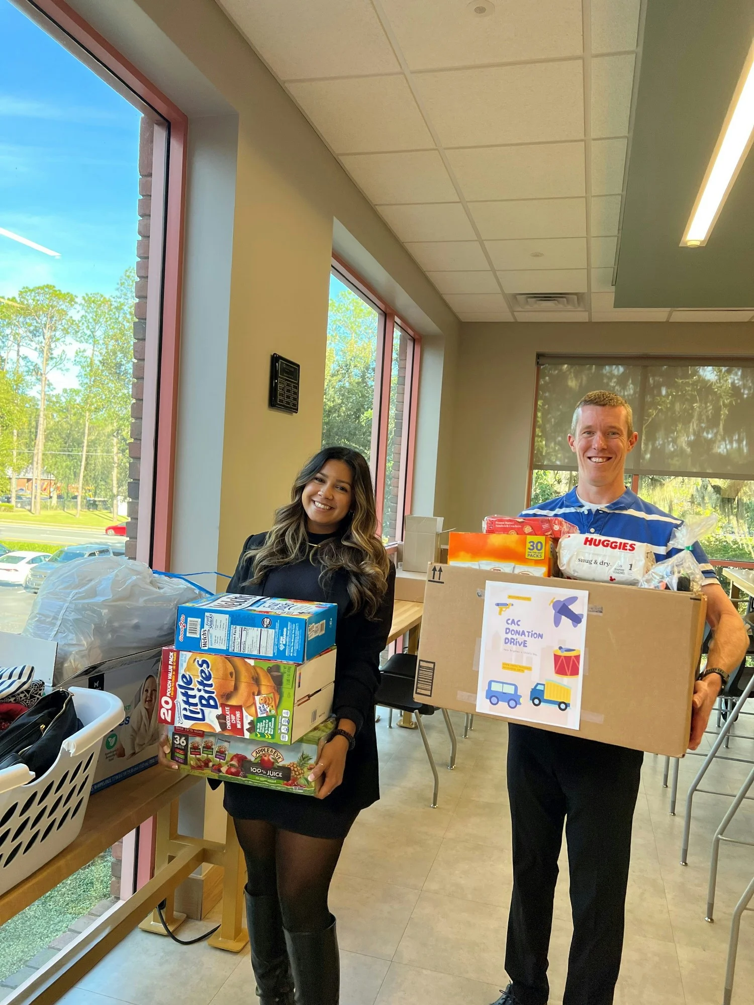 Koss Olinger participating in a donation drive for a local charity.