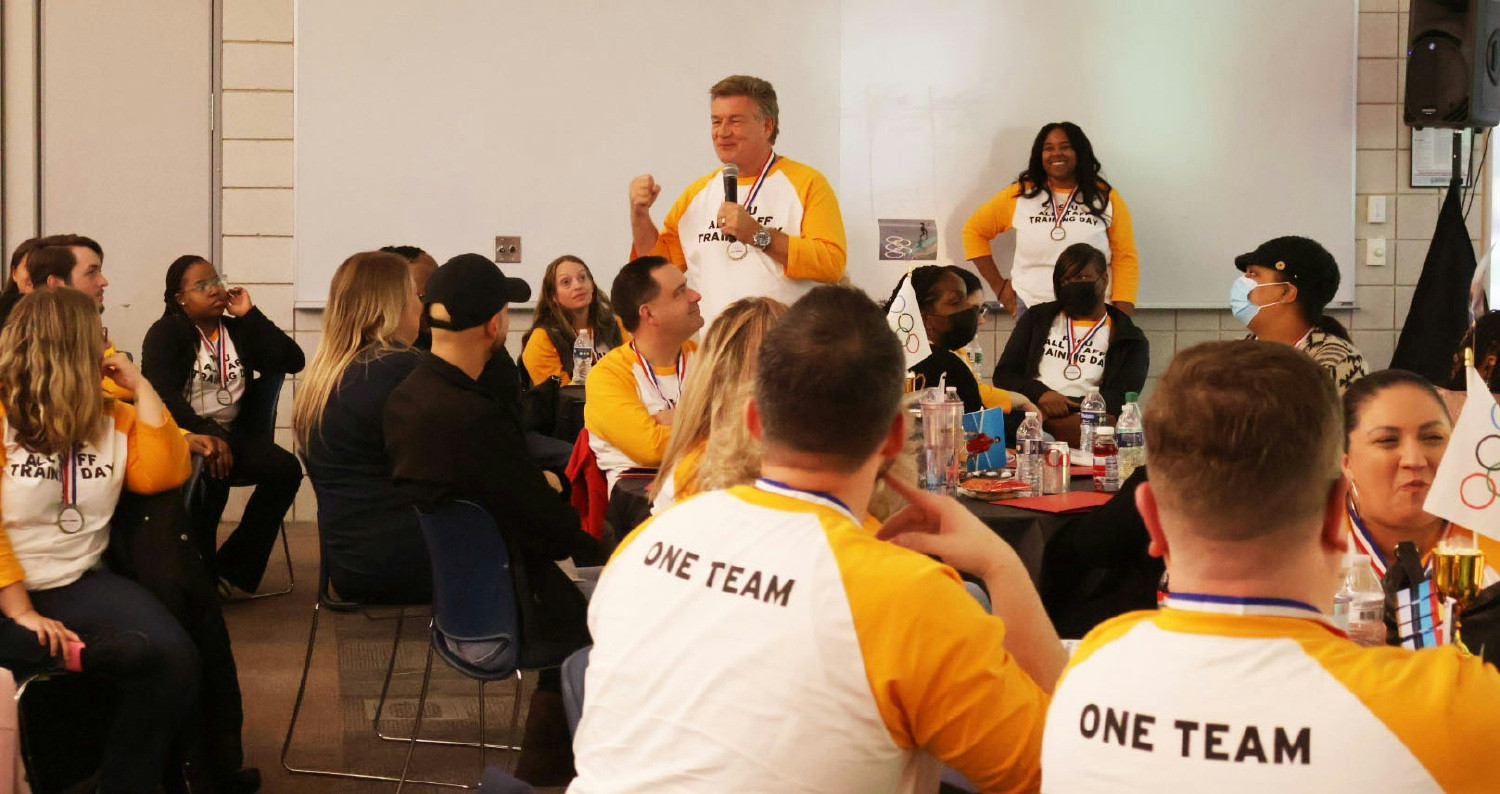 CEO, Dean Trudeau, pumping up the team at All-Staff Training Day.