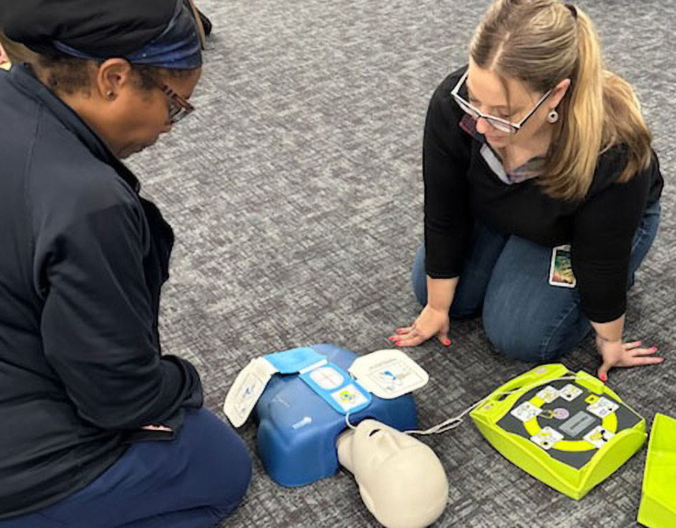 Team members learn emergency medical support skills at CPR Certification training.