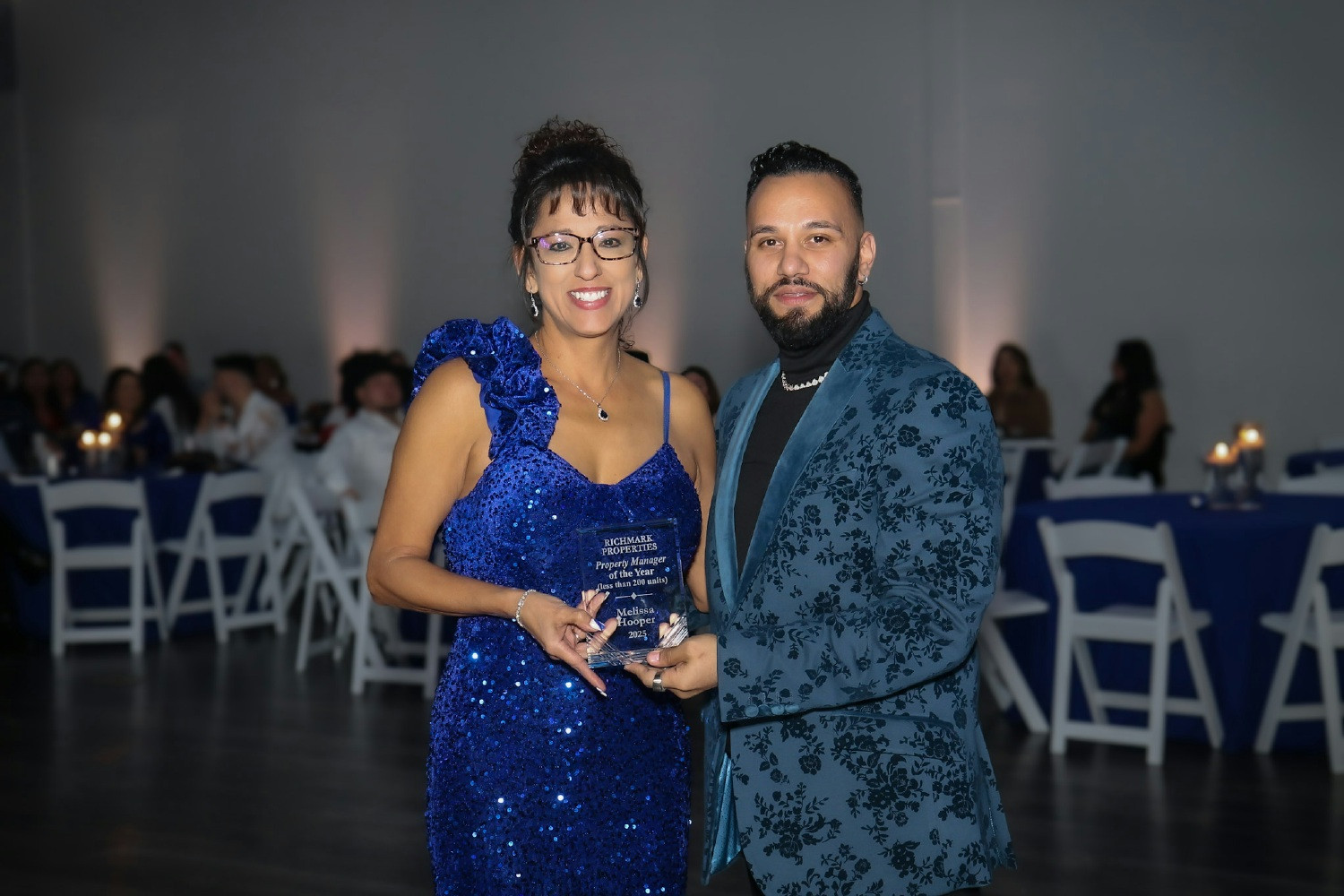 Melissa Hooper Property Mgr (left) Accepting Property Mgr of the Year Award from Jose Escobar Regional Mgr (right)