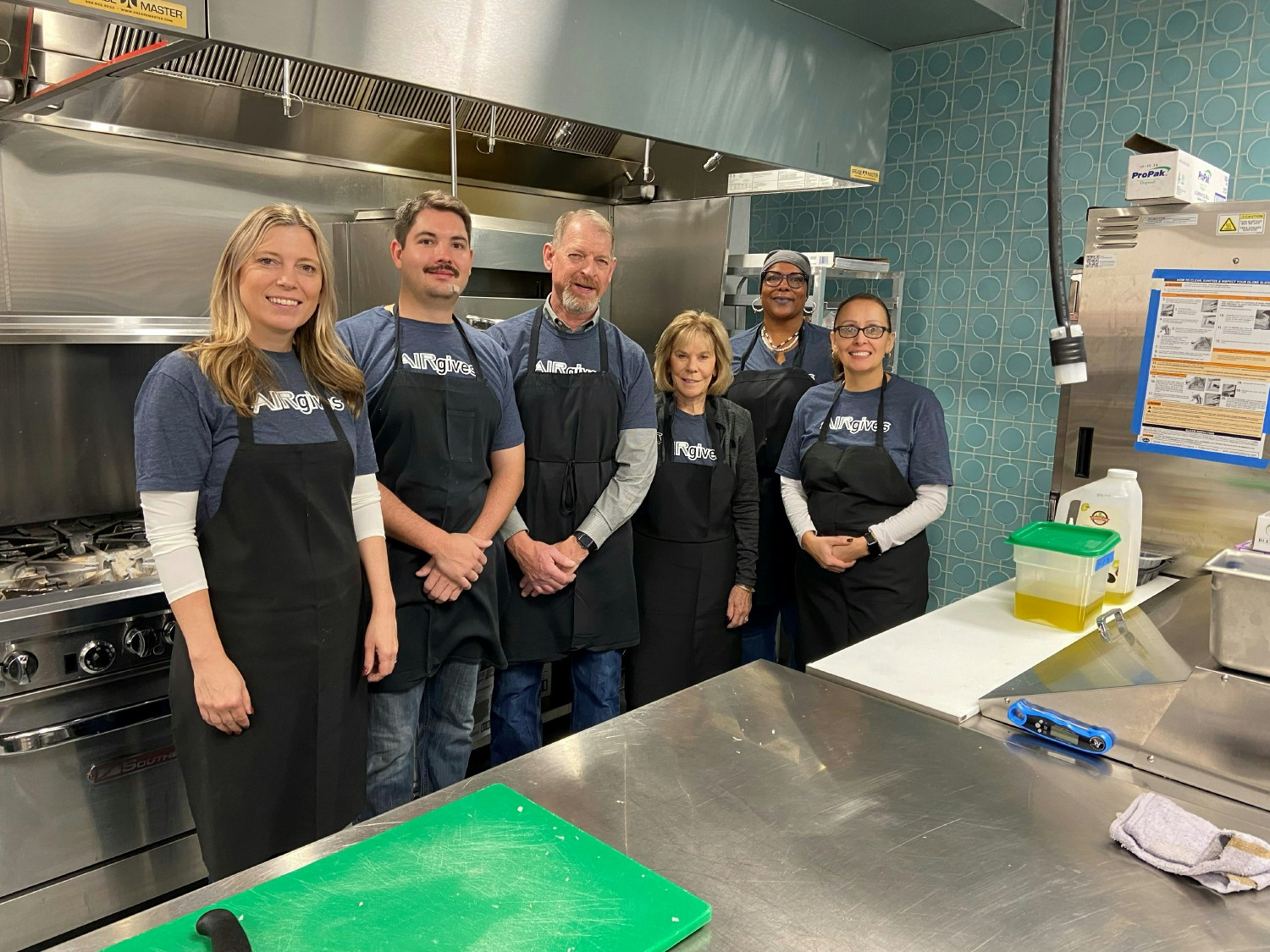 Government Relations and Risk Management teammates serve breakfast for Colorado's unhoused youth at Urban Peak.