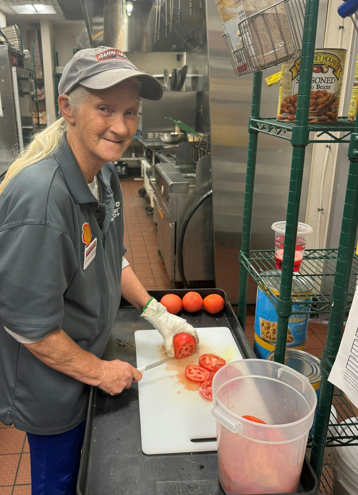 Team member using property safety cutting gloves in our stores.