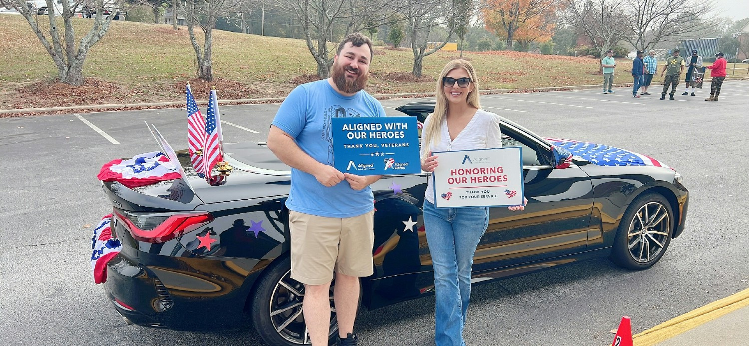 Celebrating service and supporting our local hearos through corporate commitment in a Veterans Day Parade.