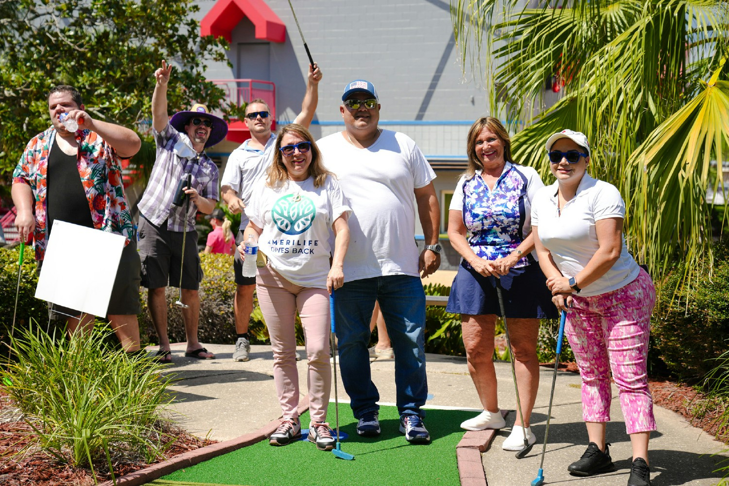 Employees enjoying Putts for a Purpose, a mini golf event supporting AmeriLife Gives Back and future Honor Flight trips