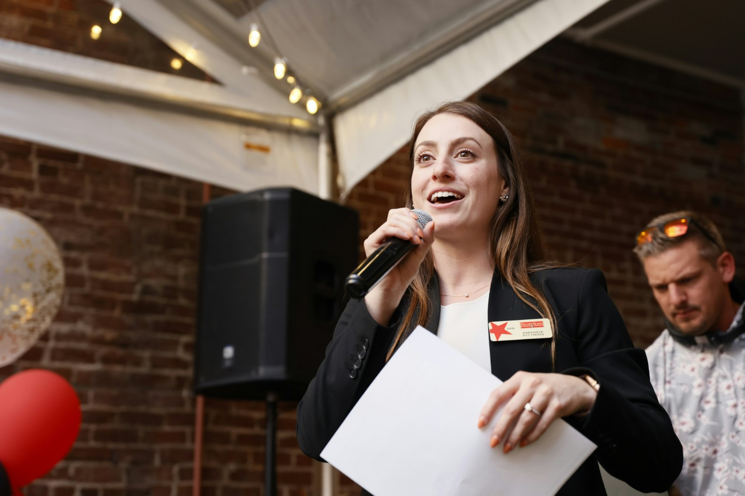 A Fischer Homes associate shares remarks with teammates, highlighting the people at the heart of the organization.